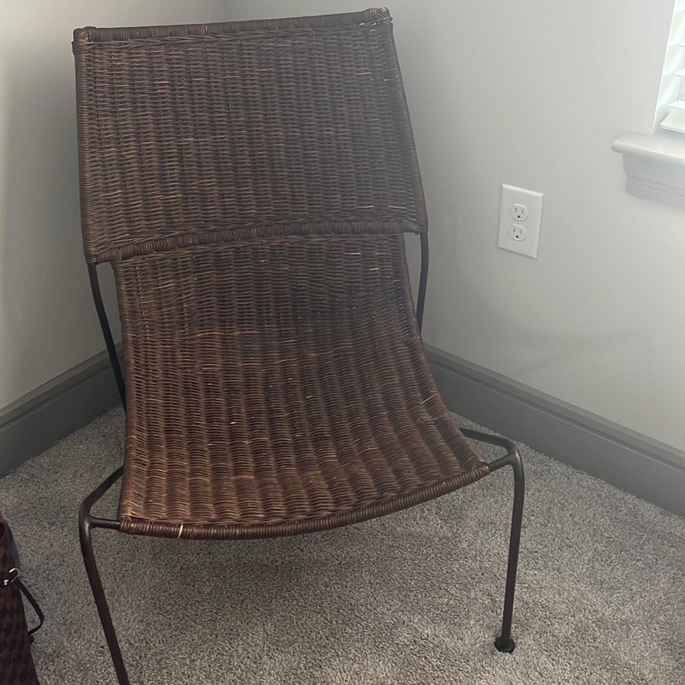 Brown hard wicker chair.
